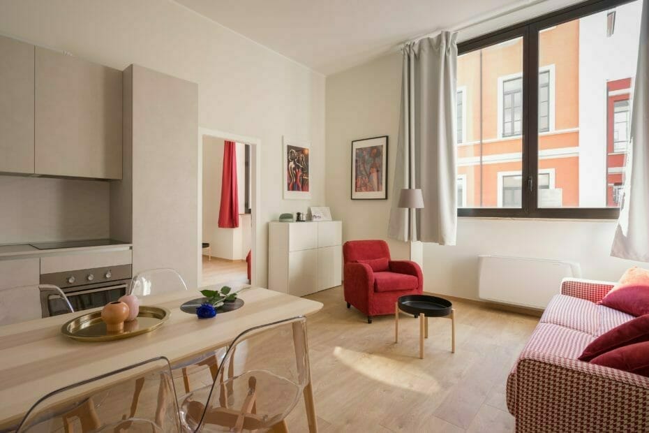 bright apartment with white and red furniture