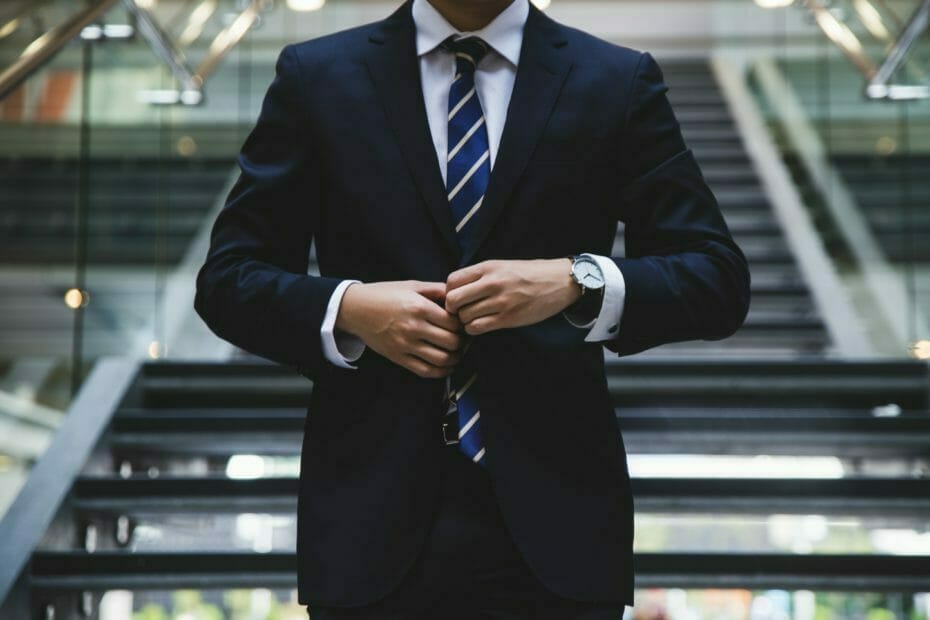 Cancel bank account. Man in suit, with tie
