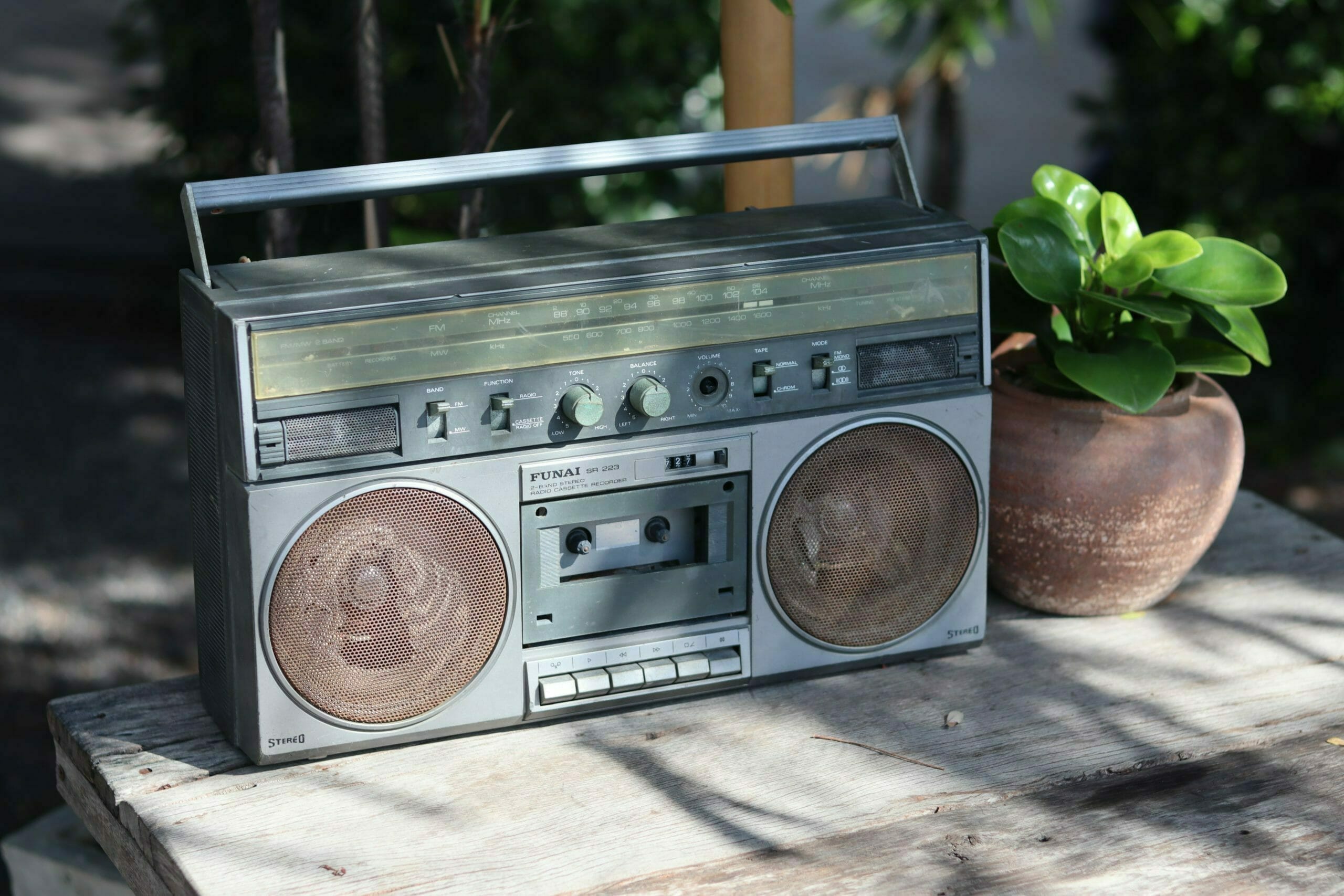 an old radio on a wooden table