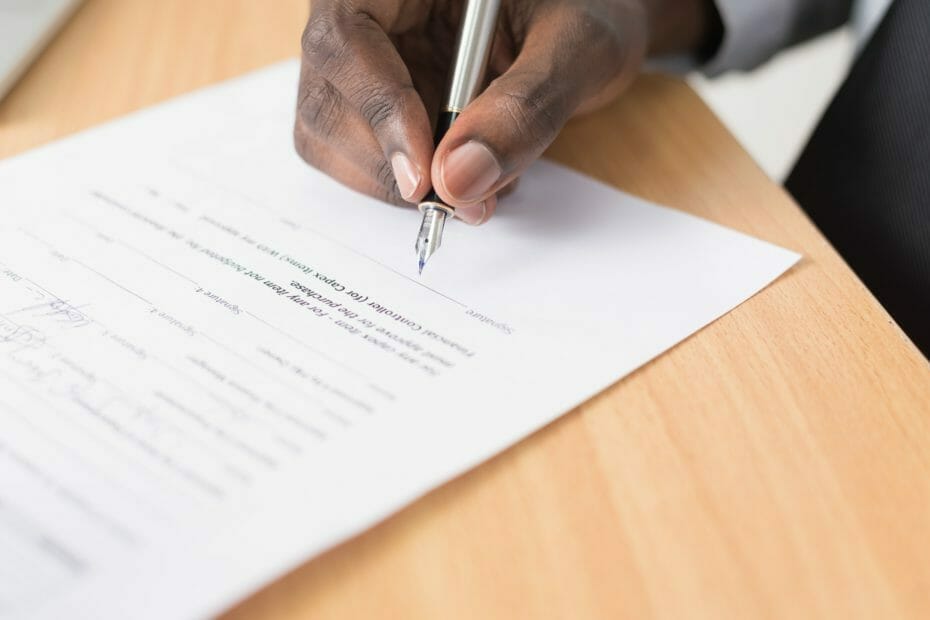 Person signs contract